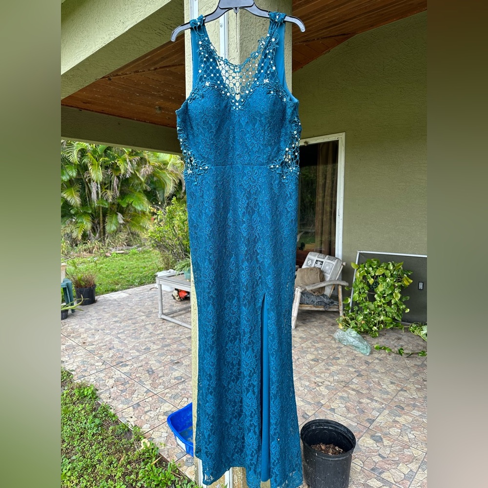 A Jodi Kristopher dress. Size 17. Color: Green
